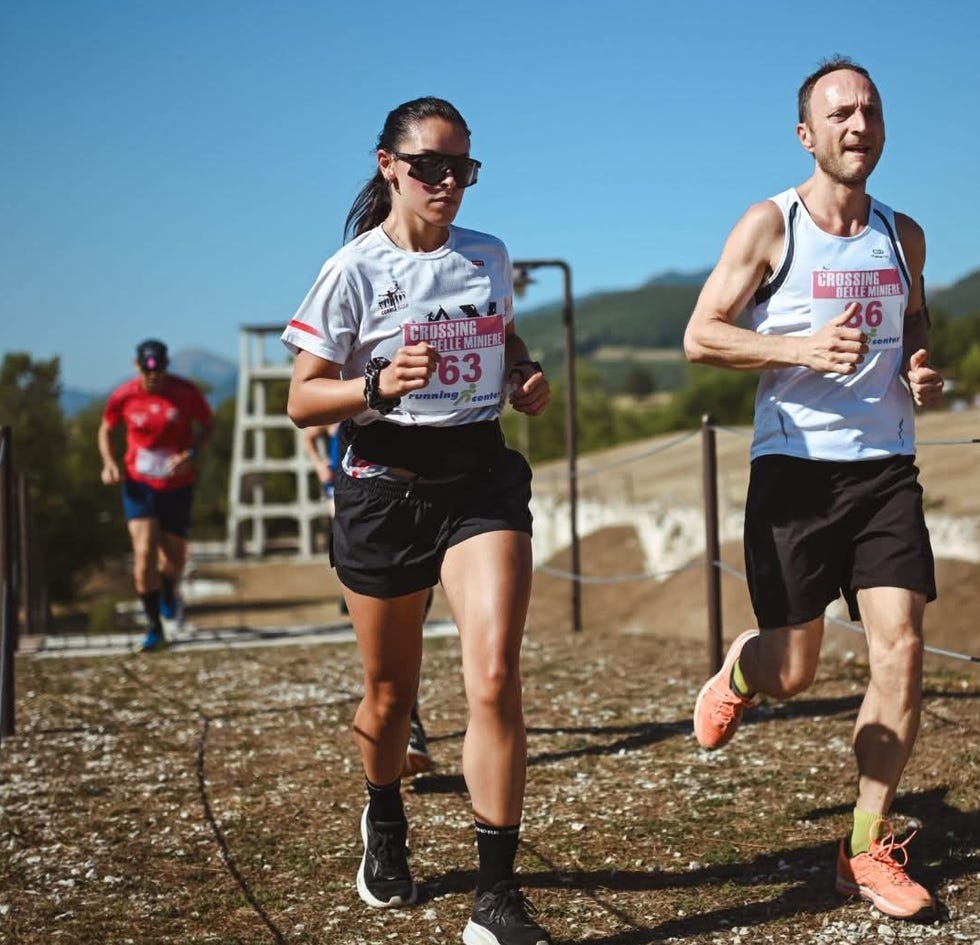 participants in a running event on an outdoor path