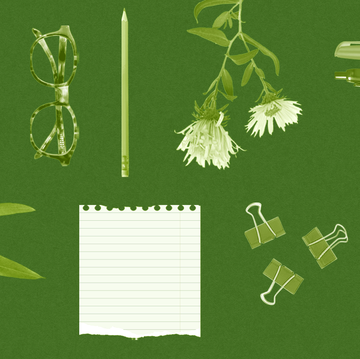 writing supplies on green background