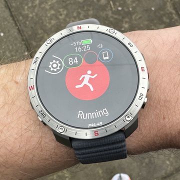 runner wearing the new polar grit x2 pro gps running pens watch