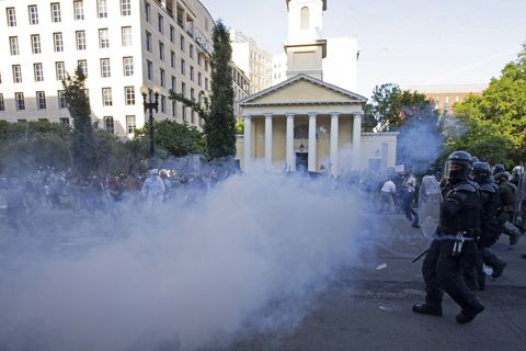topshot   police officers wearing riot gear push back demonstrators shooting tear gas next to st john's episcopal church  outside of the white house, june 1, 2020 in washington dc, during a protest over the death of george floyd   president trump visited the church while demonstrators where protesting with the trump administration branding instigators of six nights of rioting as domestic terrorists, there were more confrontations between protestors and police and fresh outbreaks of looting local us leaders appealed to citizens to give constructive outlet to their rage over the death of an unarmed black man in minneapolis, while night time curfews were imposed in cities including washington, los angeles and houston photo by jose luis magana  afp photo by jose luis maganaafp via getty images