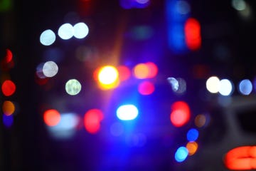 police car lights, out of focus night time view