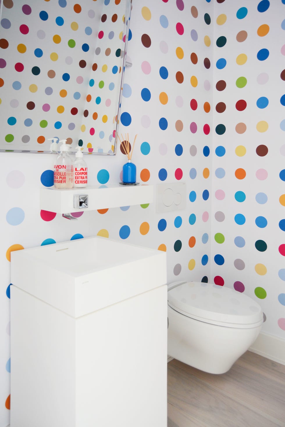 powder room with polka dot wallpaper