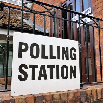 uk polling station sign outside church premises