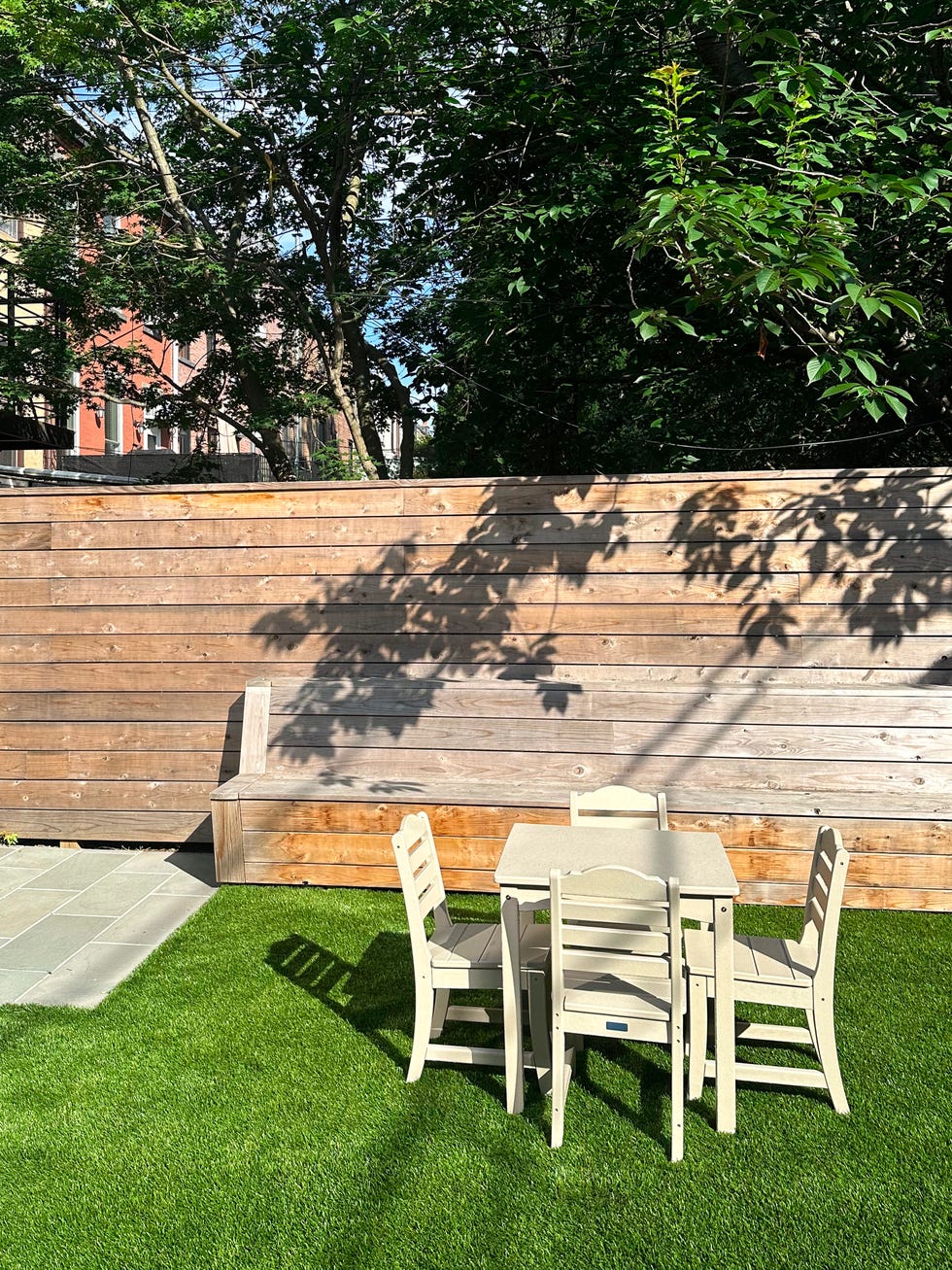 outdoor seating area with a table and chairs on green grass savannah kids 5 piece dining set