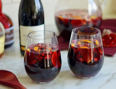 pomegranate sangria in stemless wine glasses