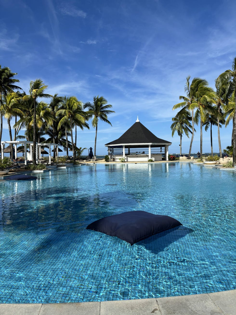 a pool with a building in the background