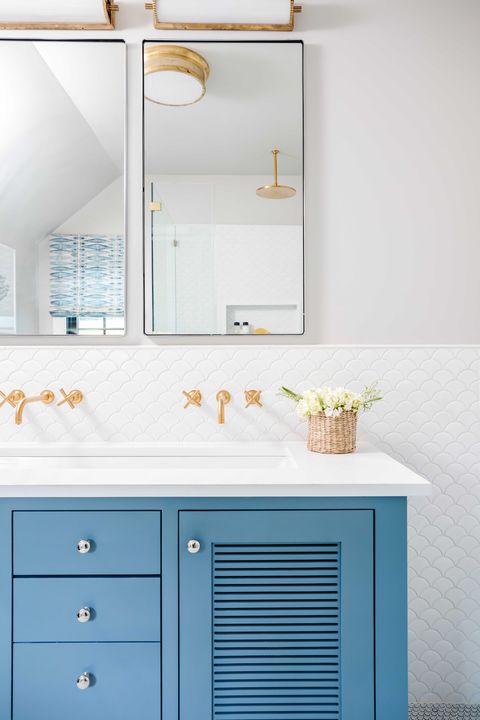 guest bathroom, white scallop tiles, blue cabinets