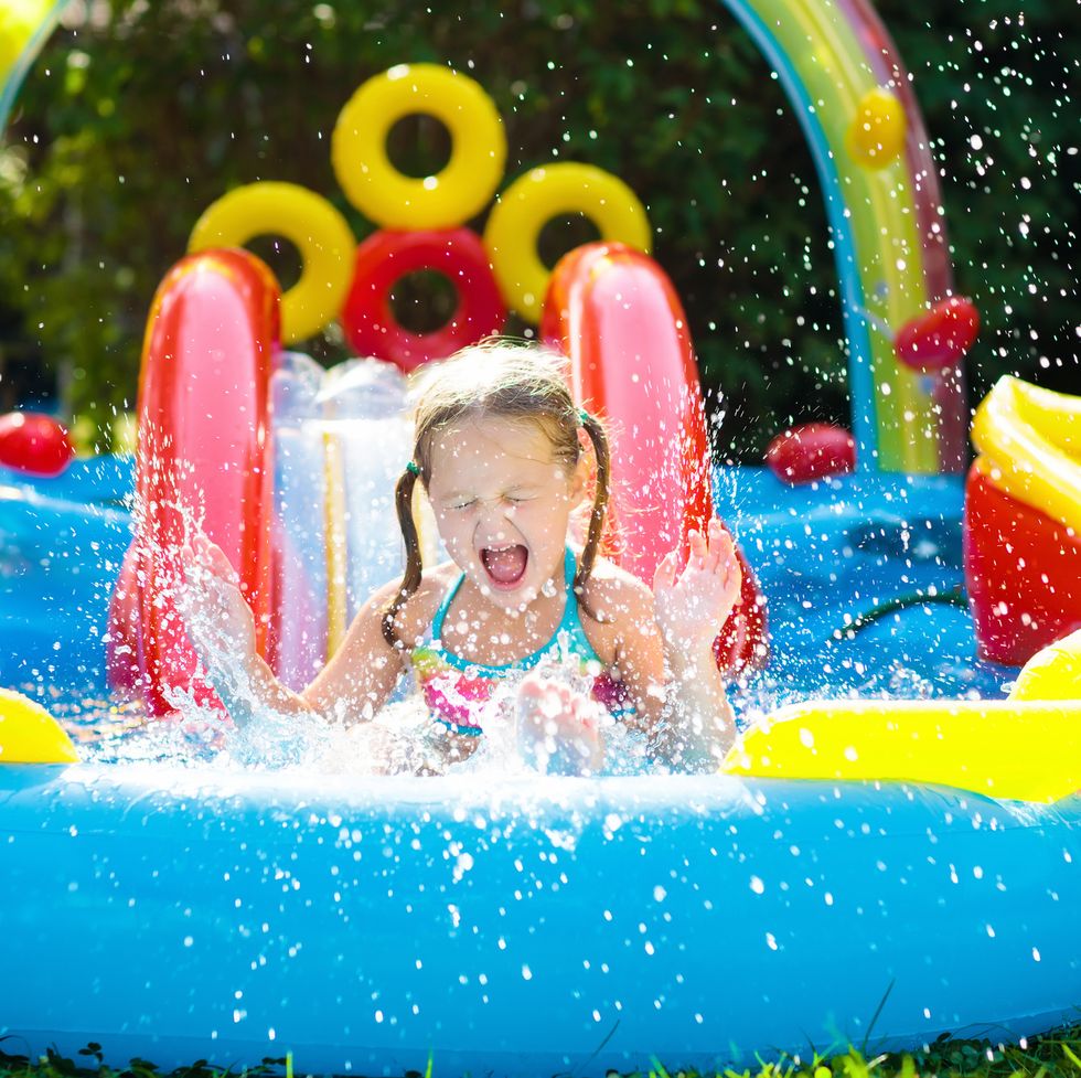 child playing in inflatable kid's pool