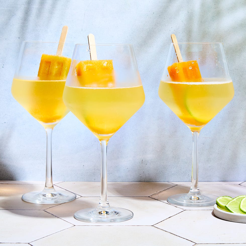 spritz with orange popsicles in them by a pool