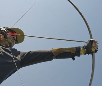 male archer drawing english longbow