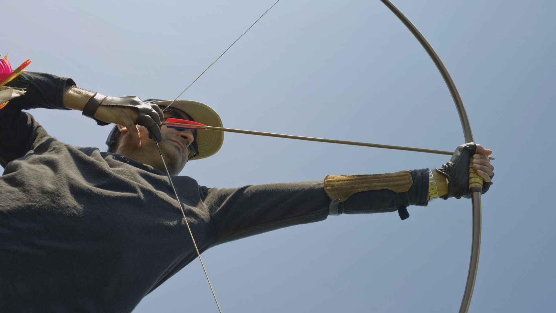 male archer drawing english longbow
