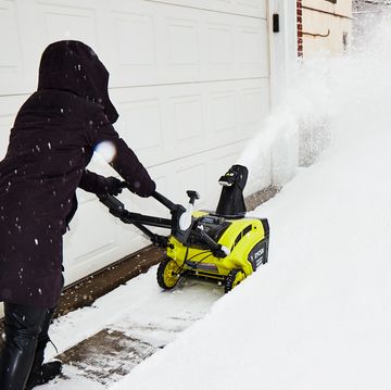 a person using a snow blower