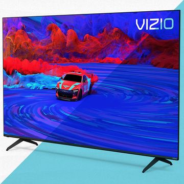 vizio flatscreen tv on legs against blue and white background