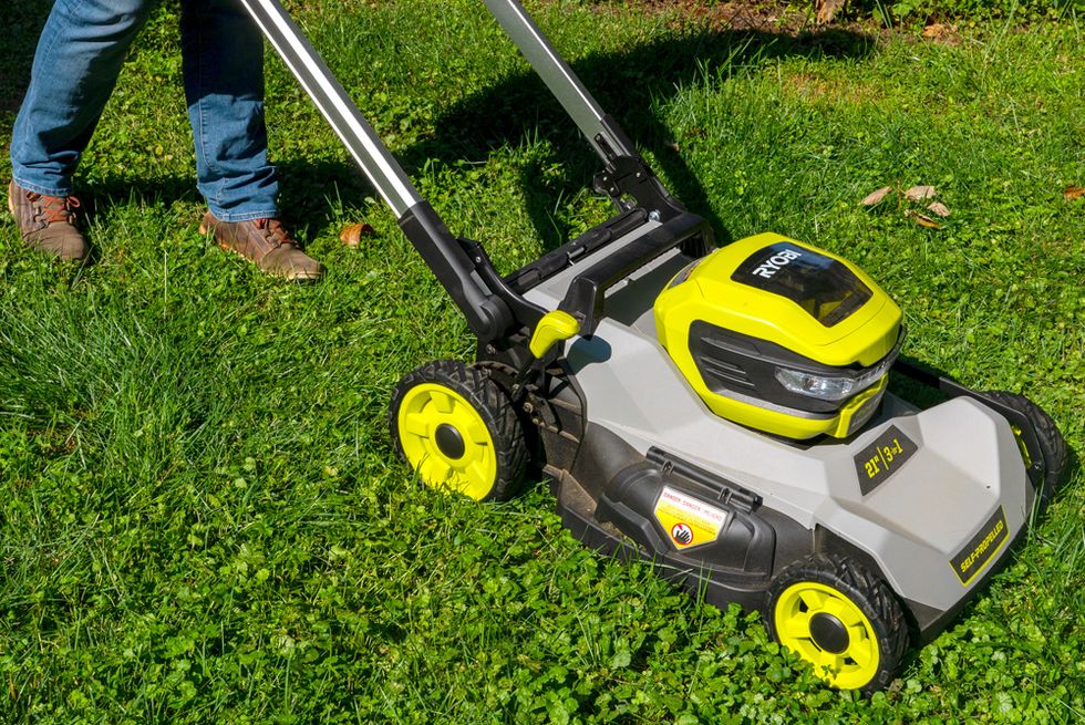 a person using a lawn mower