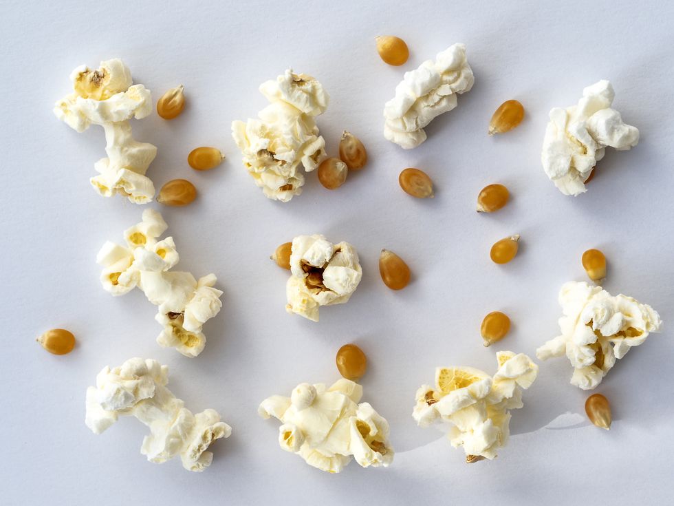 popcorn and seeds on a white background