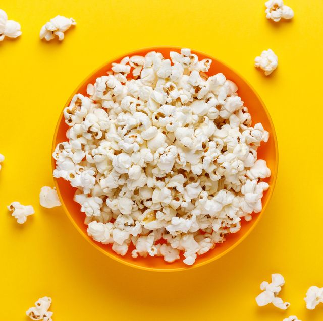 https://hips.hearstapps.com/hmg-prod/images/popcorn-in-an-orange-bowl-on-yellow-background-royalty-free-image-1666056789.jpg?crop=0.670xw:1.00xh;0.167xw,0&resize=640:*