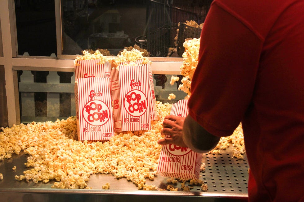 popcorn vendor inside a concession stand