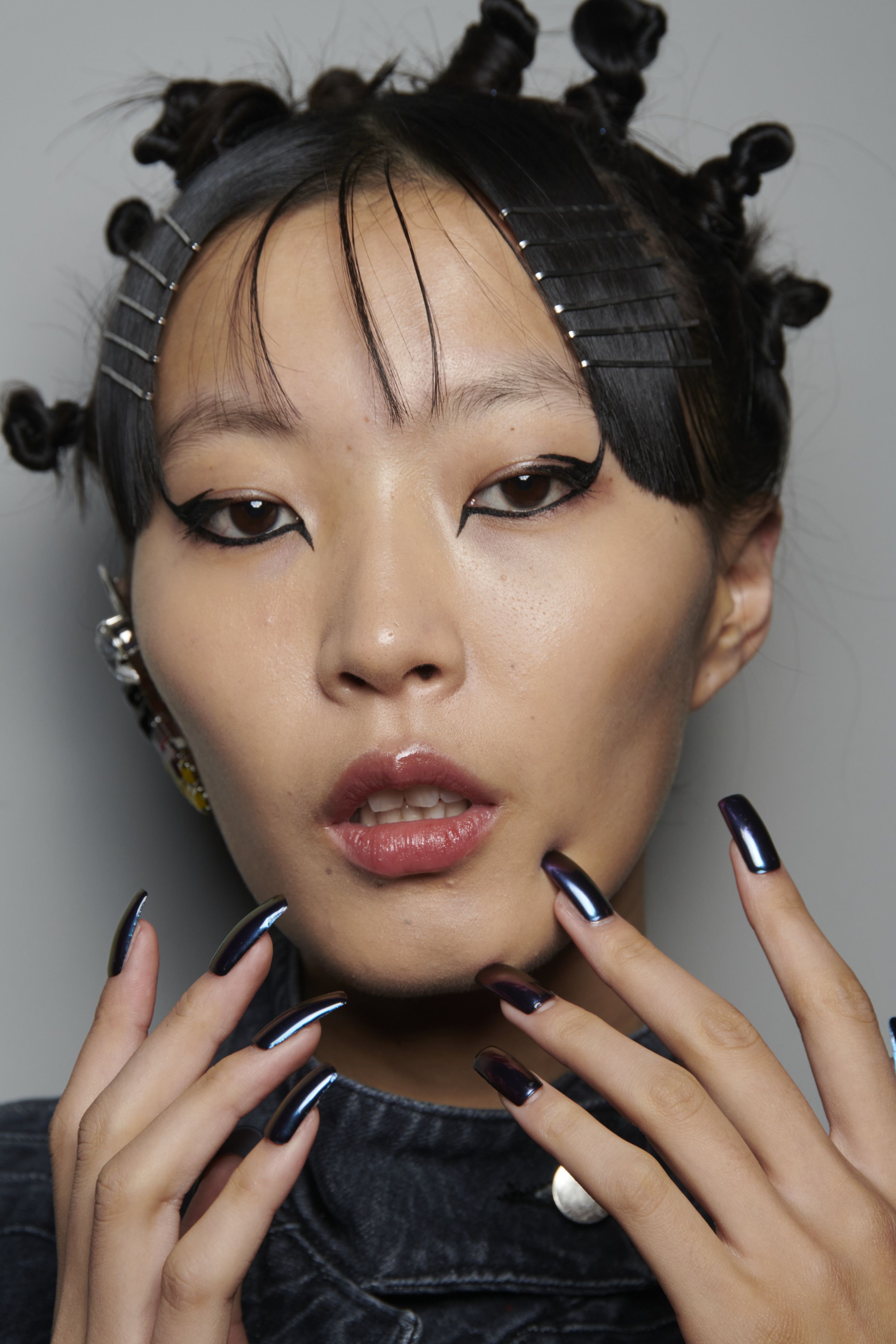 Metallic eyebrows and nail art added a playful touch to Peter Do's  tomboyish SS23 collection., nail art, eyebrow