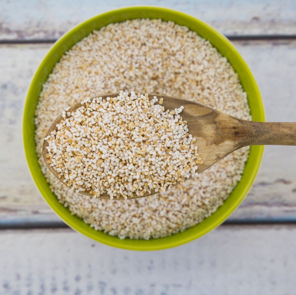 popped organic amarant on wood spoon and in bowl for good housekeeping's healthiest grain story
