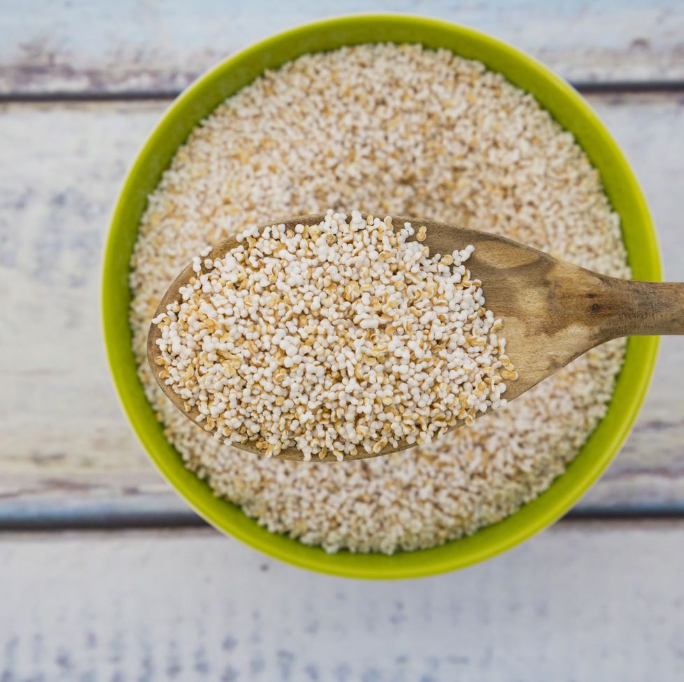 popped organic amarant on wood spoon and in bowl