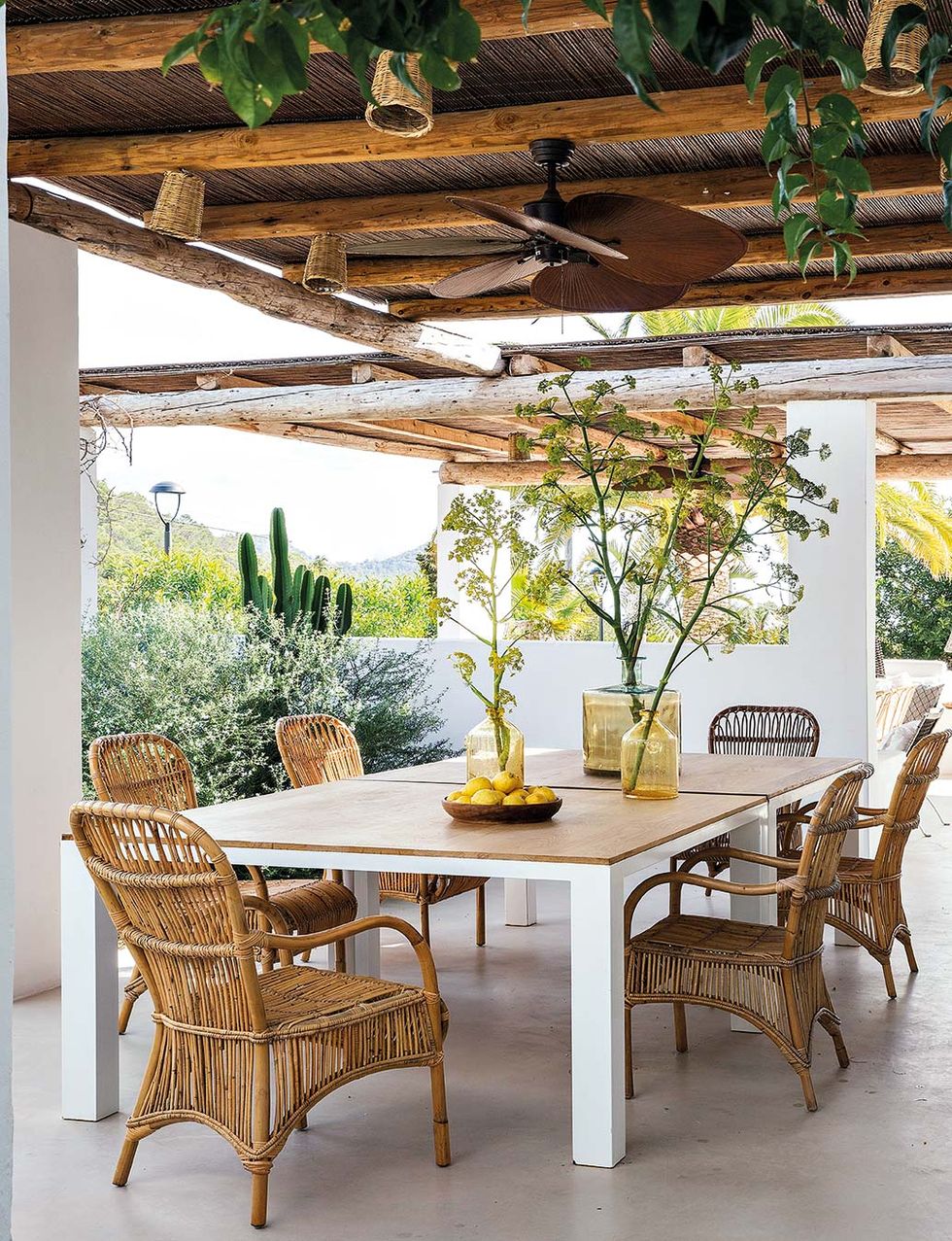 tables to eat on the porch or garden dining room with fiber armchairs