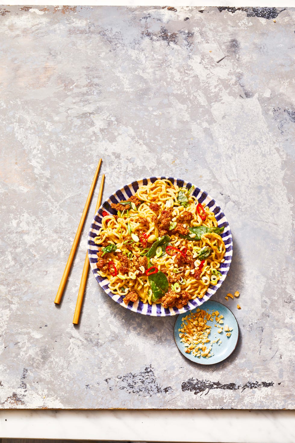crispy pork noodles with chopsticks