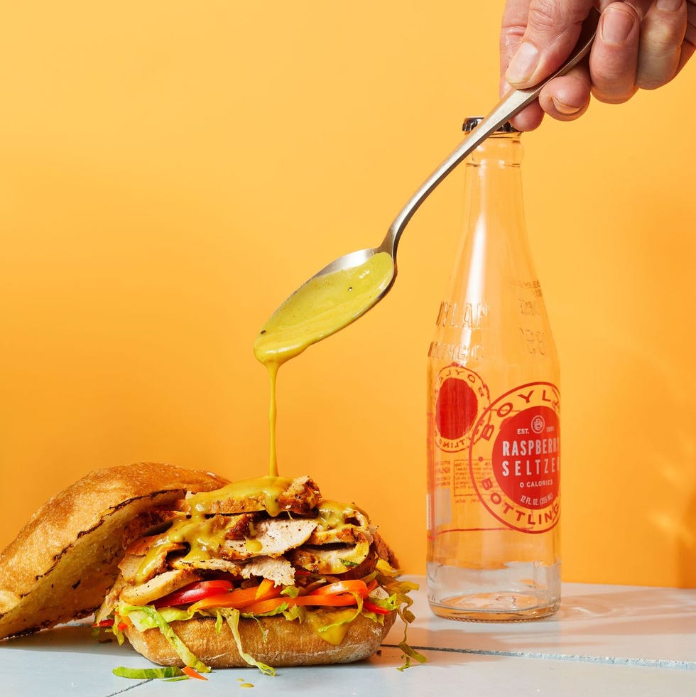 pork tenderloin sandwiches with a yellow sauce poured on top