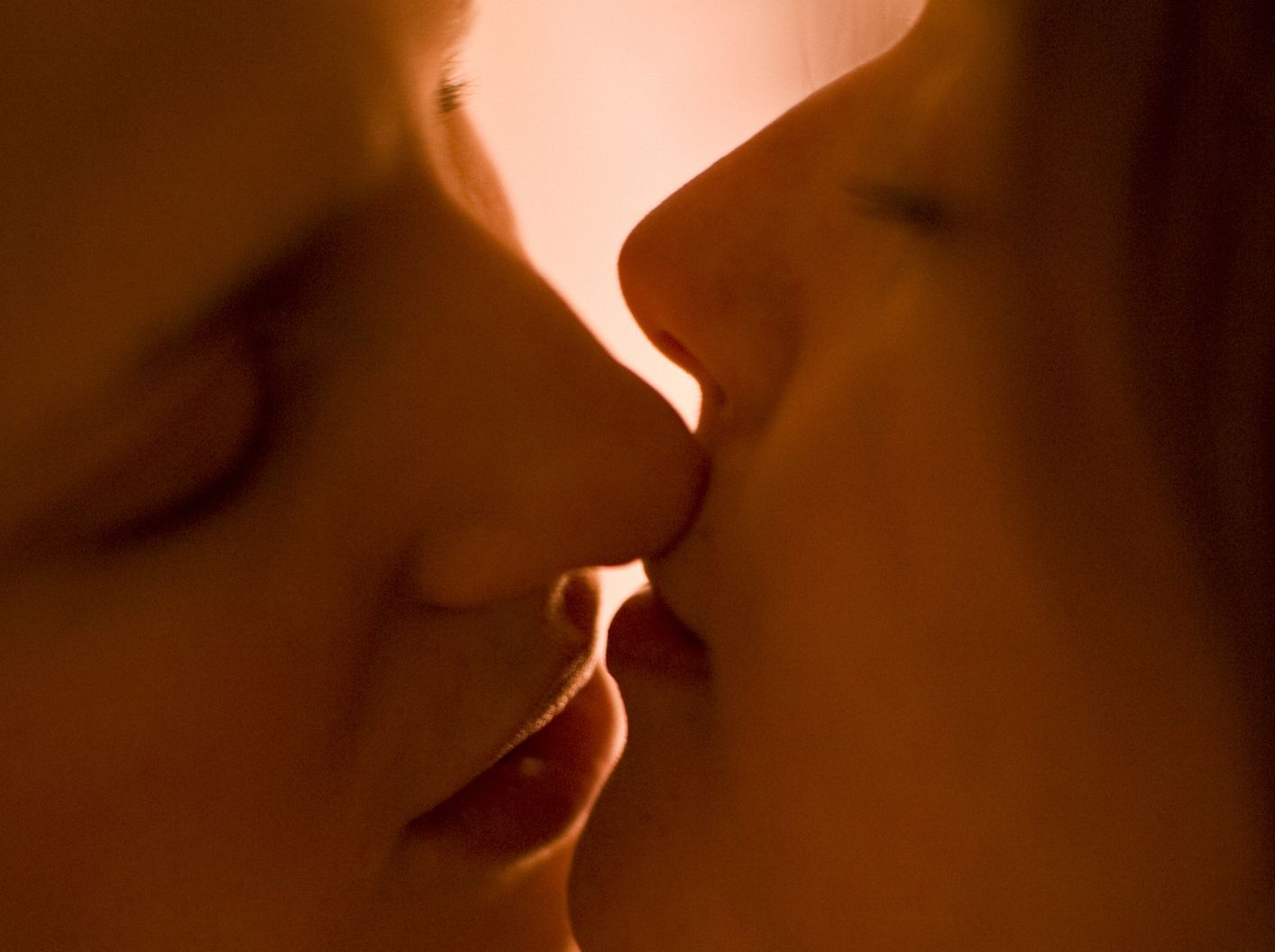 a man and woman kissing