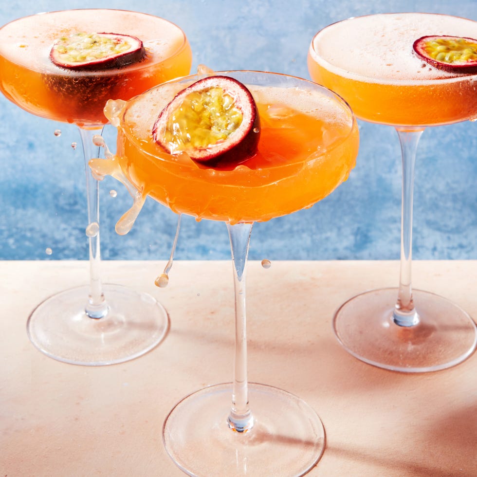 porn star martinis in coupe glasses with a passion fruit half