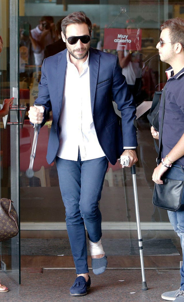 Clothing, Blazer, Jeans, Outerwear, Snapshot, Fashion, Suit, Footwear, Crutch, Shoe, 