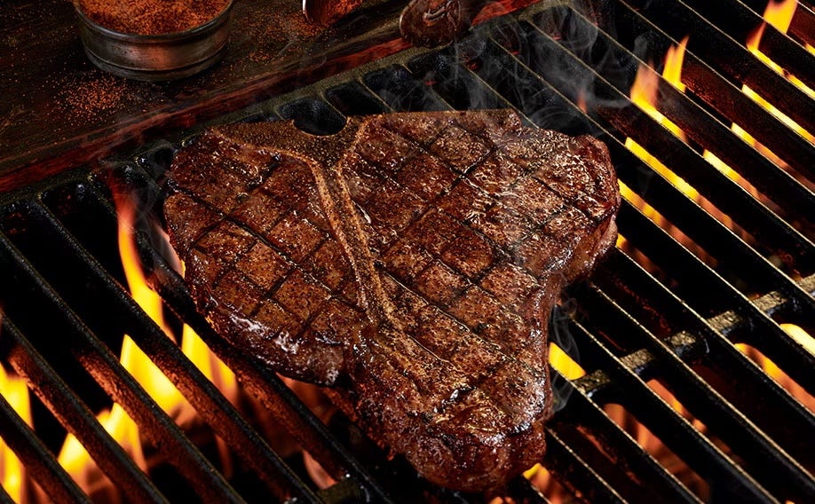 grilled tbone steak on a barbecue grill