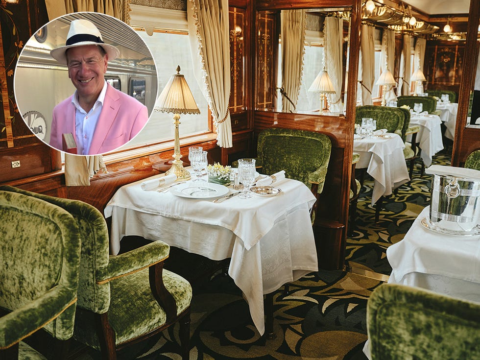 a person in a cowboy hat sitting at a table with a set of chairs and a table with
