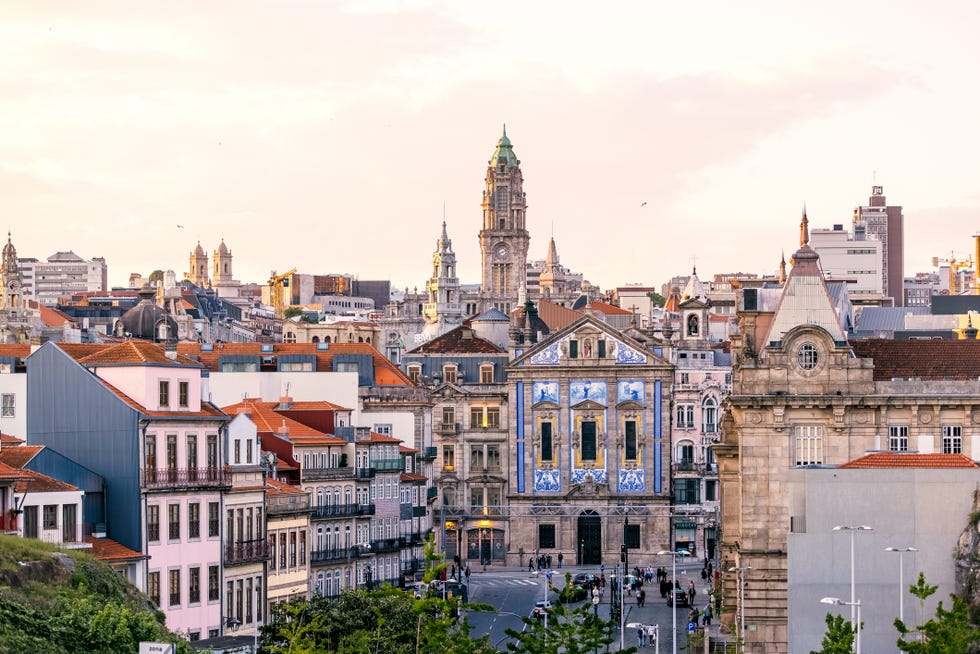 porto cityscape at sunset with tower of porto town hall in the center, portugal