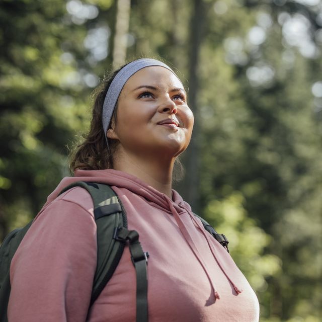 portrait of a beautiful woman hiker smiling