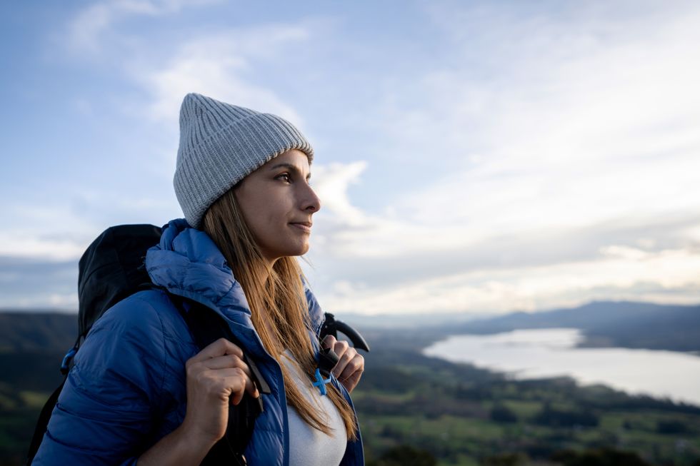 portrait of a female hiker looking at the landscape