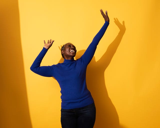 Portrait of a mature woman dancing and laughing