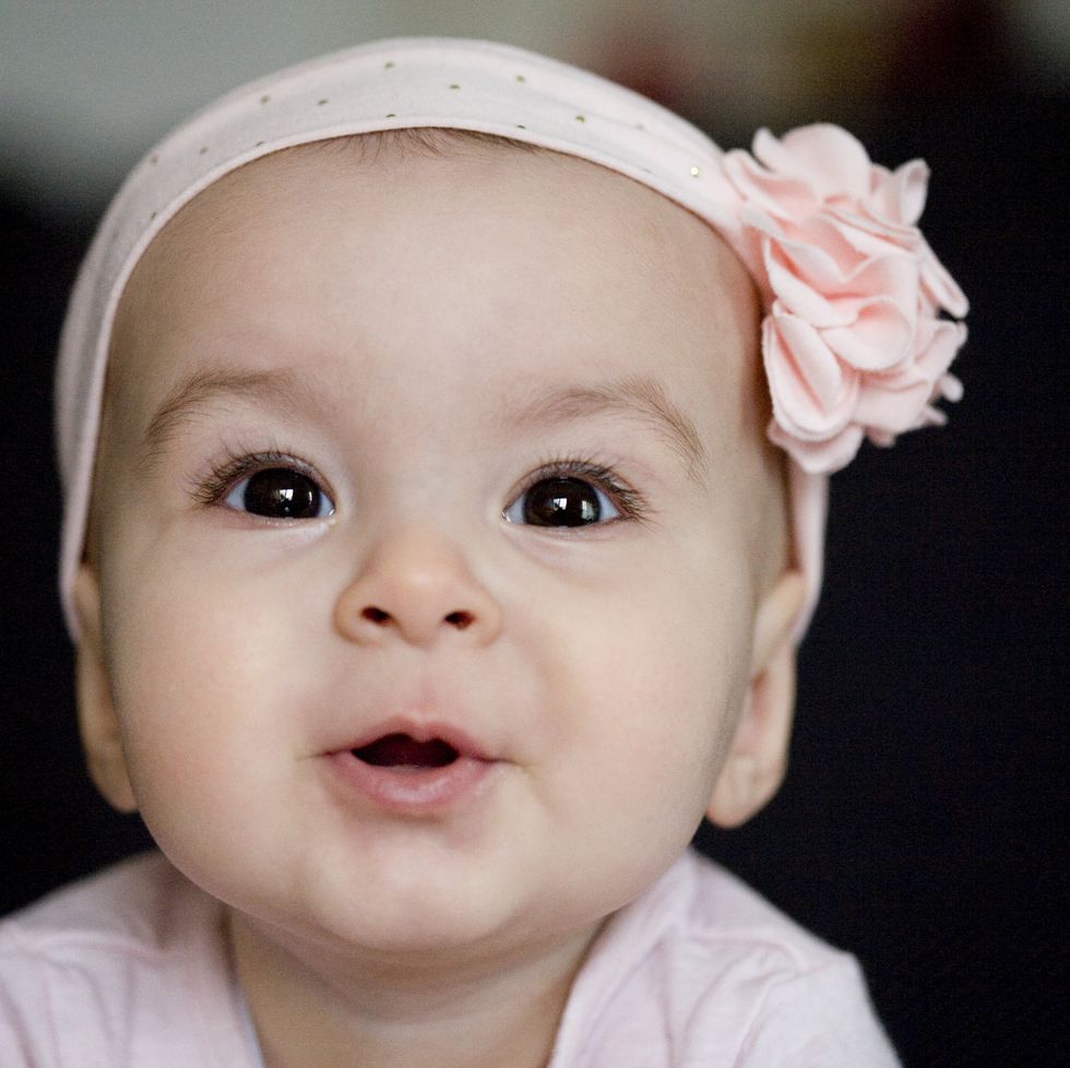 portrait of a smiling baby with hairband