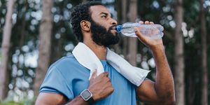 portrait of a sporty man drinking water