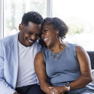 portrait of affectionate mature couple sitting on sofa
