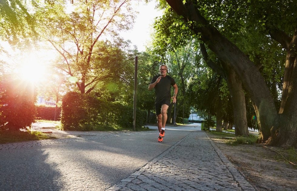 portrait of an active senior man doing exercise in the city of berlin