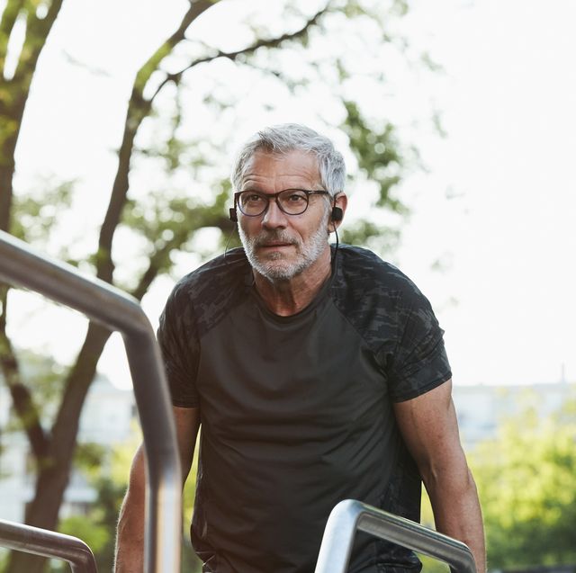 portrait of an active senior man doing exercise in the city of berlin
