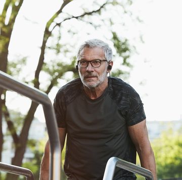 portrait of an active senior man doing exercise in the city of berlin