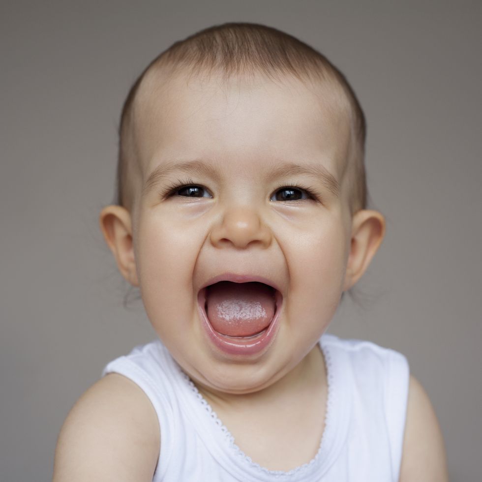 portrait of baby giggling