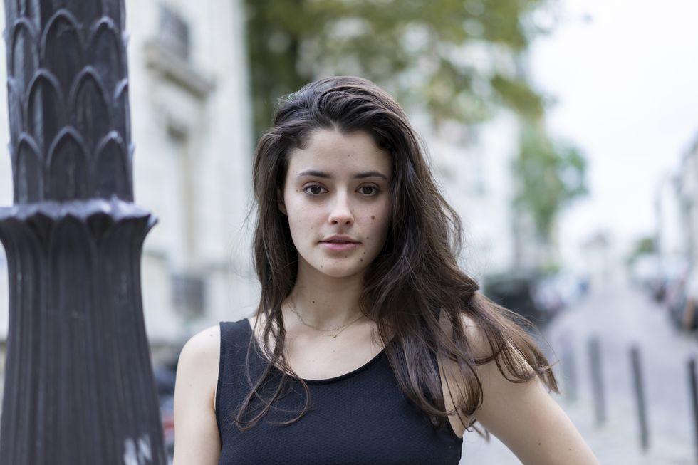 Portrait of beautiful young woman in the city
