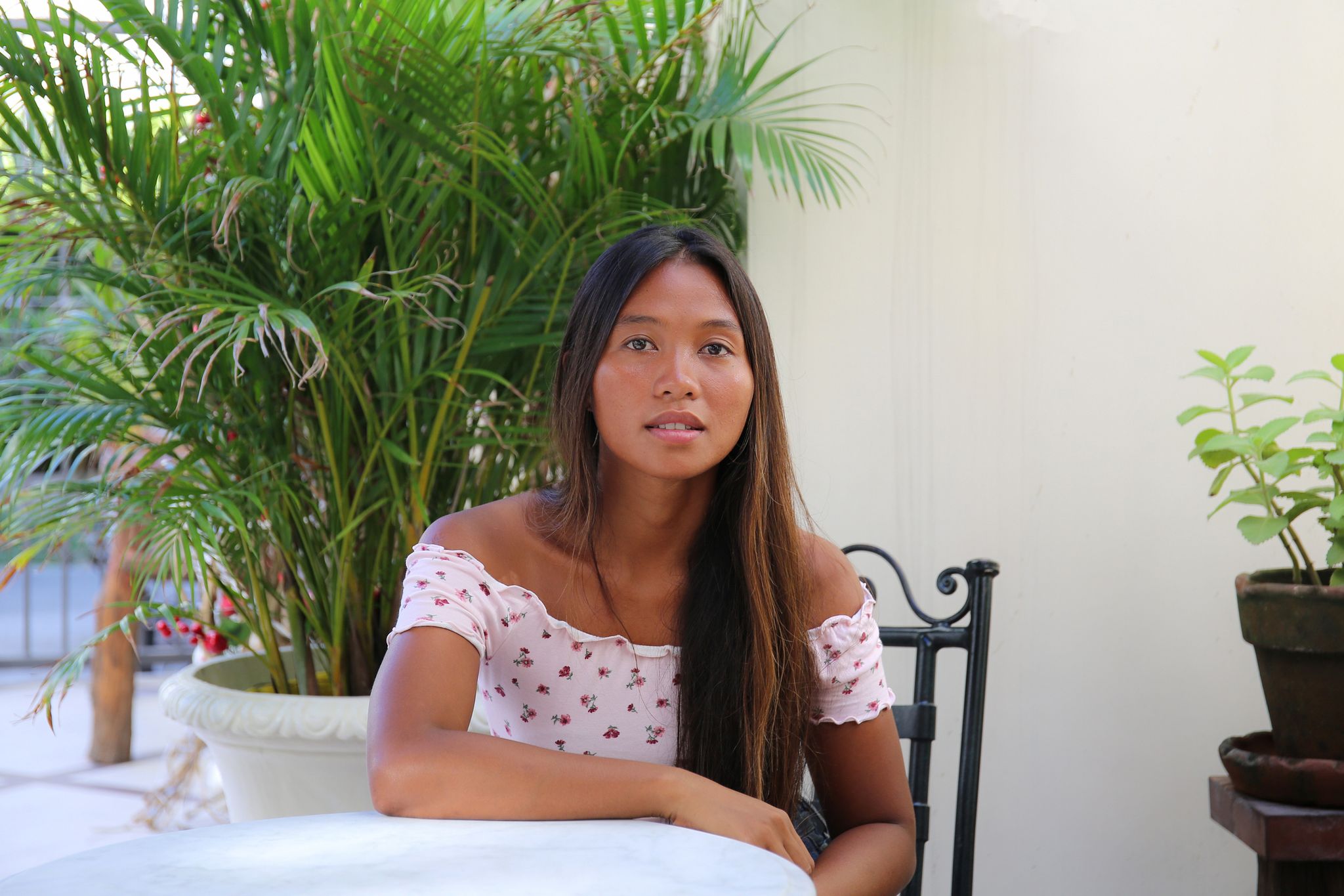 portrait of beauty confident dark skin Asian woman sat outside