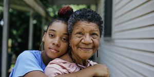 portrait of black grandmother with teenager granddaughter