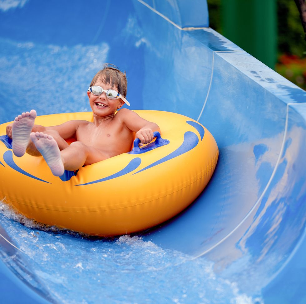 portrait of cute boy sitting on inflatable ring