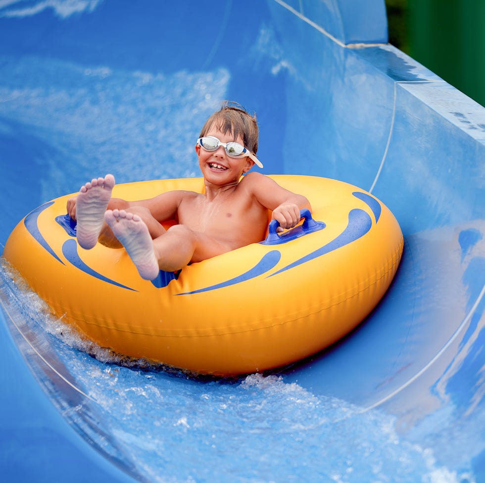 portrait of cute boy sitting on inflatable ring