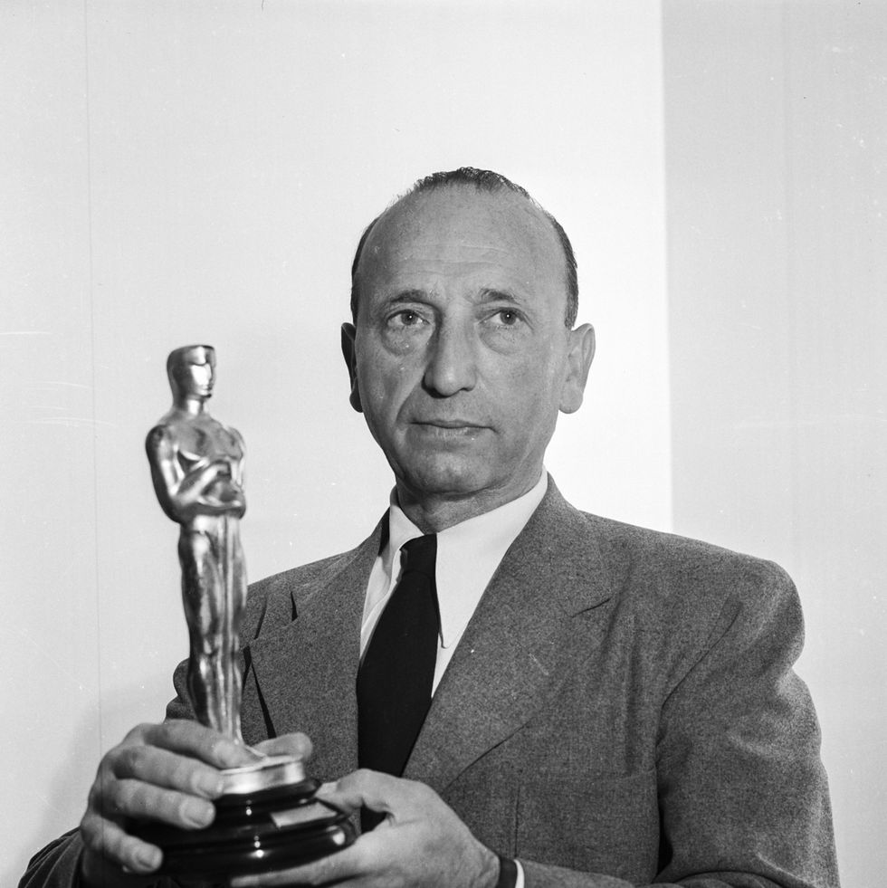 portrait of director michael curtiz (1886 1962) holding his academy award, for his film 'casablana', with warner brothers studios, 1944. (photo via john kobal foundation/getty images)