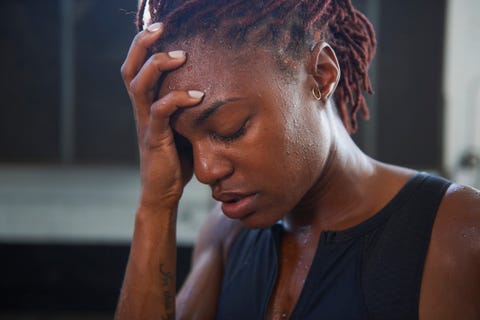 portrait of frustrated black woman sweating